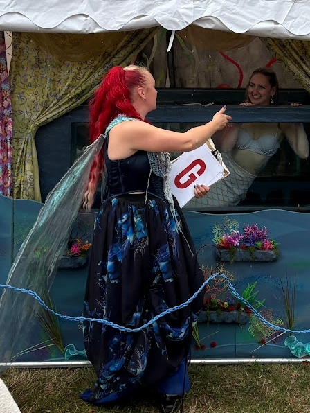 Ocean Oracle with a Mermaid in our travelling water tank at a festival
